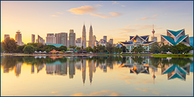 Coface Asia Payment Survey 2022. Panoramic view of Kuala Lumpur city waterfront skyline with reflections and beautiful morning sky, Titiwangsa Park, Malaysia. 