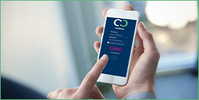 CofaMove: the Coface app for on-the-go credit risk management. The photo shows a user logging into the CofaMove app. 
